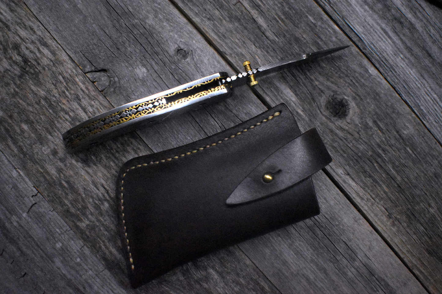 Damascus Pocket Knife – Carved Steel Handle